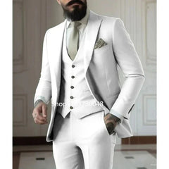 A man wearing a slim-fit white three-piece suit consisting of a jacket, vest, and trousers.