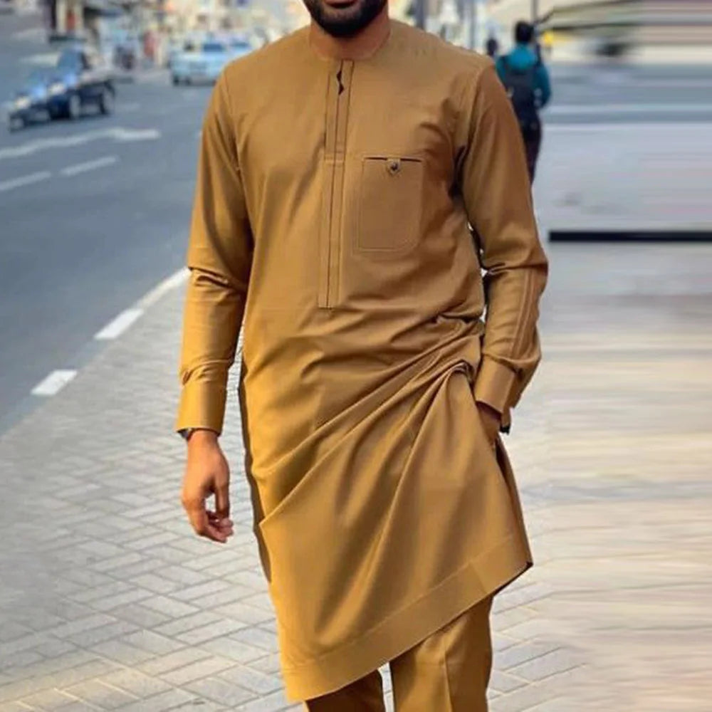 Men's traditional African Kaftan set by SHOWLU FASHION STORE, featuring a vibrant dashiki outfit with intricate patterns and matching trousers.