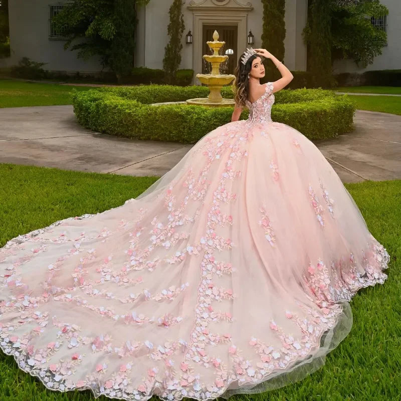 Showlu Pink Quinceanera dress with off-shoulder neckline and 3D floral lace ball gown design, featuring elegant details and fitted bodice.