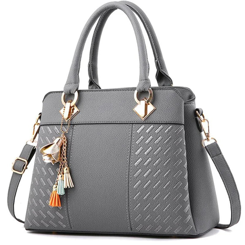 Large black PU leather tote bag with luxury embroidery and tassel from SHOWLU FASHION STORE, featuring spacious interior and stylish design.