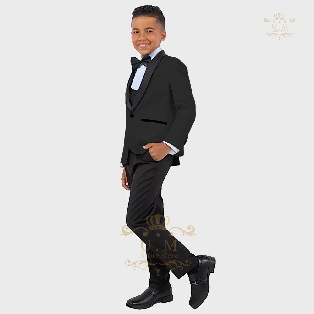 Boy wearing a white tuxedo jacket, vest, and pants from ZHIO Boys' 3-Piece Formal Suit by SHOWLU FASHION STORE.