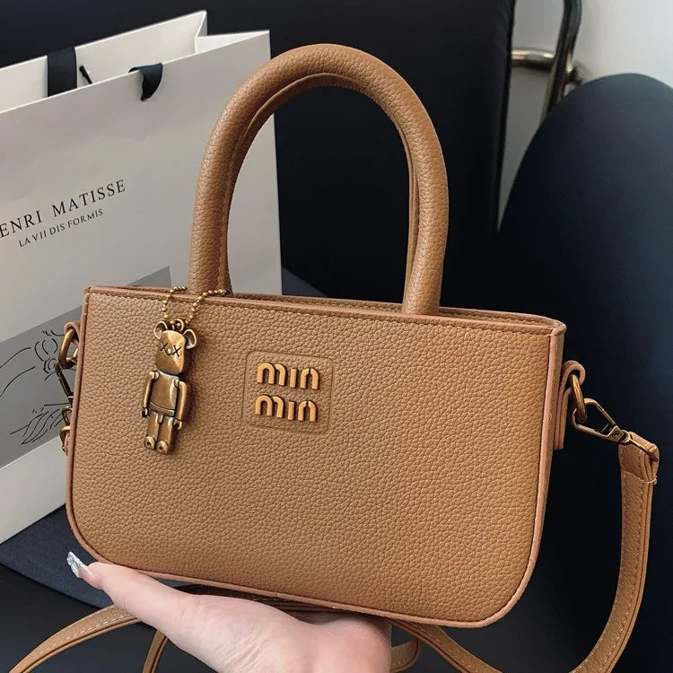 Minimalist luxury phone pouch and crossbody bag by 1170uf-he with sleek design and compact size, perfect for modern essentials.