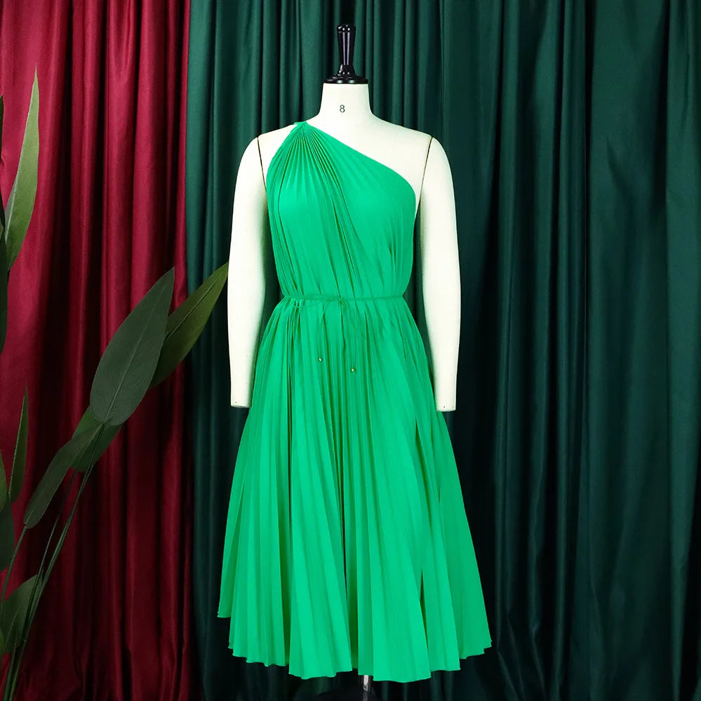 Women’s one-shoulder sleeveless pleated knee-length swing dress by Showlu Fashion, stylish and chic for 2023 fashion trends.