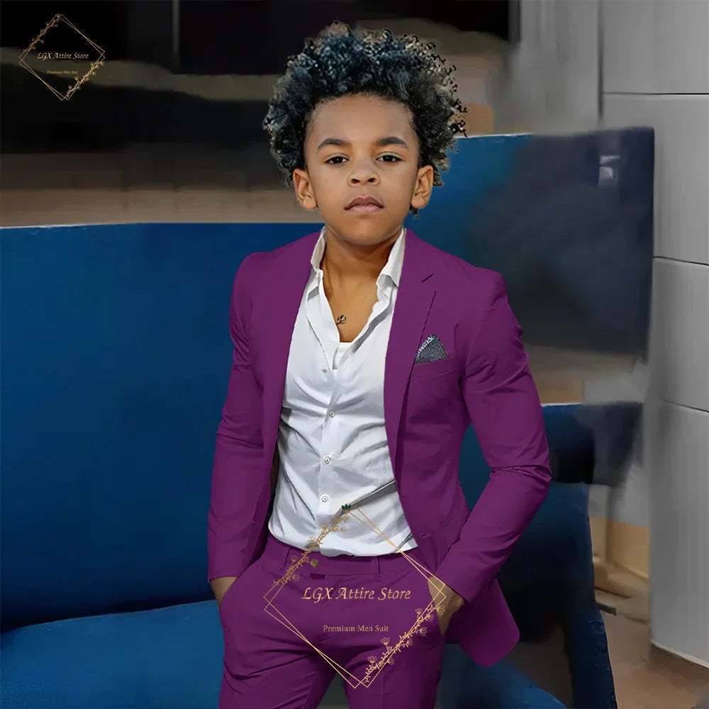 Boy wearing SHOWLU FASHION STORE orange slim fit 2-piece suit with single-breasted twill blazer and matching pants.