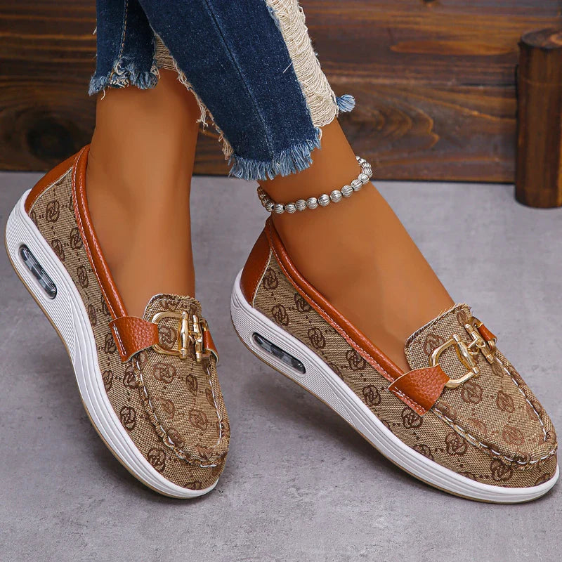Roar Uthaug women's retro flat slip-on shoes with round toe and metal decor, showcasing a stylish and comfortable footwear design.
