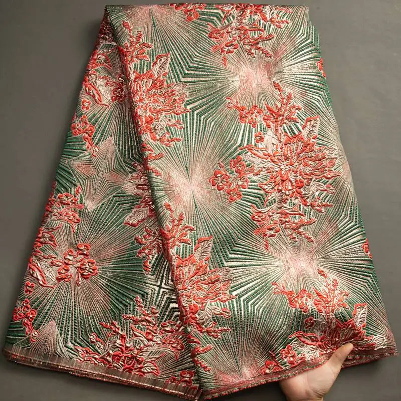Nigerian Damask tulle fabric with floral brocade jacquard lace design, showcasing intricate patterns in vibrant colors.
