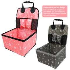 Two portable pet car booster seats with paw and bone patterns, one pink and one grey.