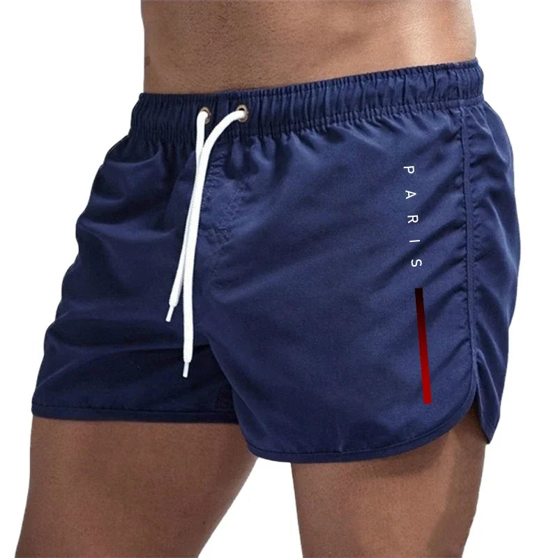 Men's summer board shorts by Showlu Fashion, casual sports swimwear with a stylish design for beach, gym, and surfing activities.