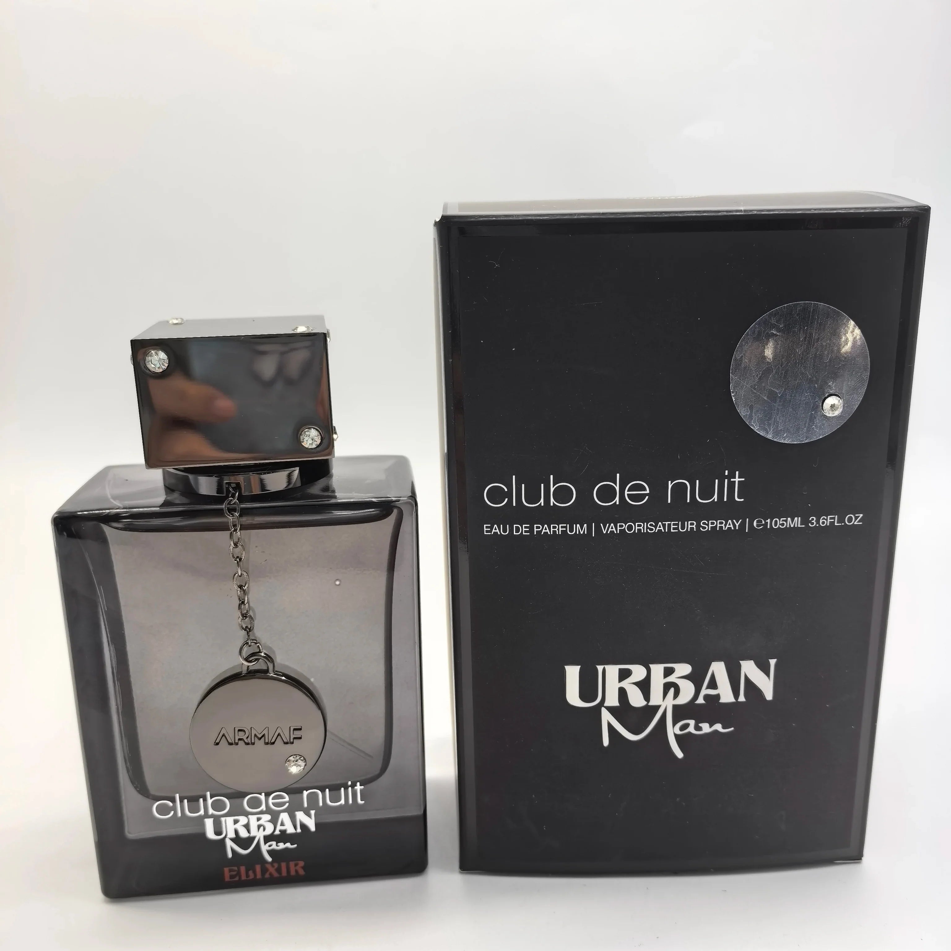 Armaf Club De Nuit Urban Man Elixir EDP perfume bottle for men, 105ml, with sleek design and dark-colored fragrance bottle.