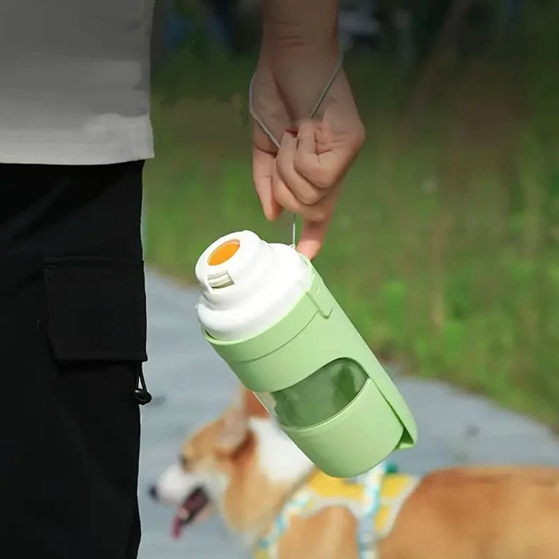 Showlu 2-in-1 portable pet water bottle and food container with 500ml capacity, designed for travel and outdoor use.