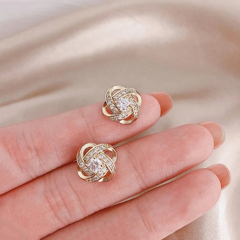 Showlu Fashion zircon cross stud earrings with geometric copper design, showcasing elegant jewelry craftsmanship.