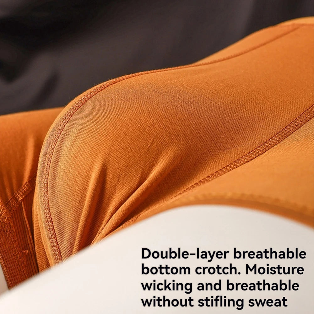 Three pairs of Showlu Fashion men's cotton antibacterial boxer underwear with double-layer, breathable U pouch design.