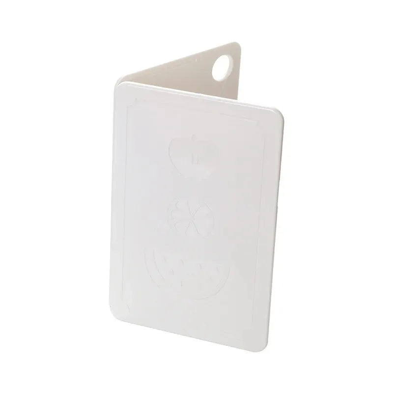 Showlu Smart General collapsible cutting board folded with handle and non-slip feet, compact and space-saving kitchen prep tool.