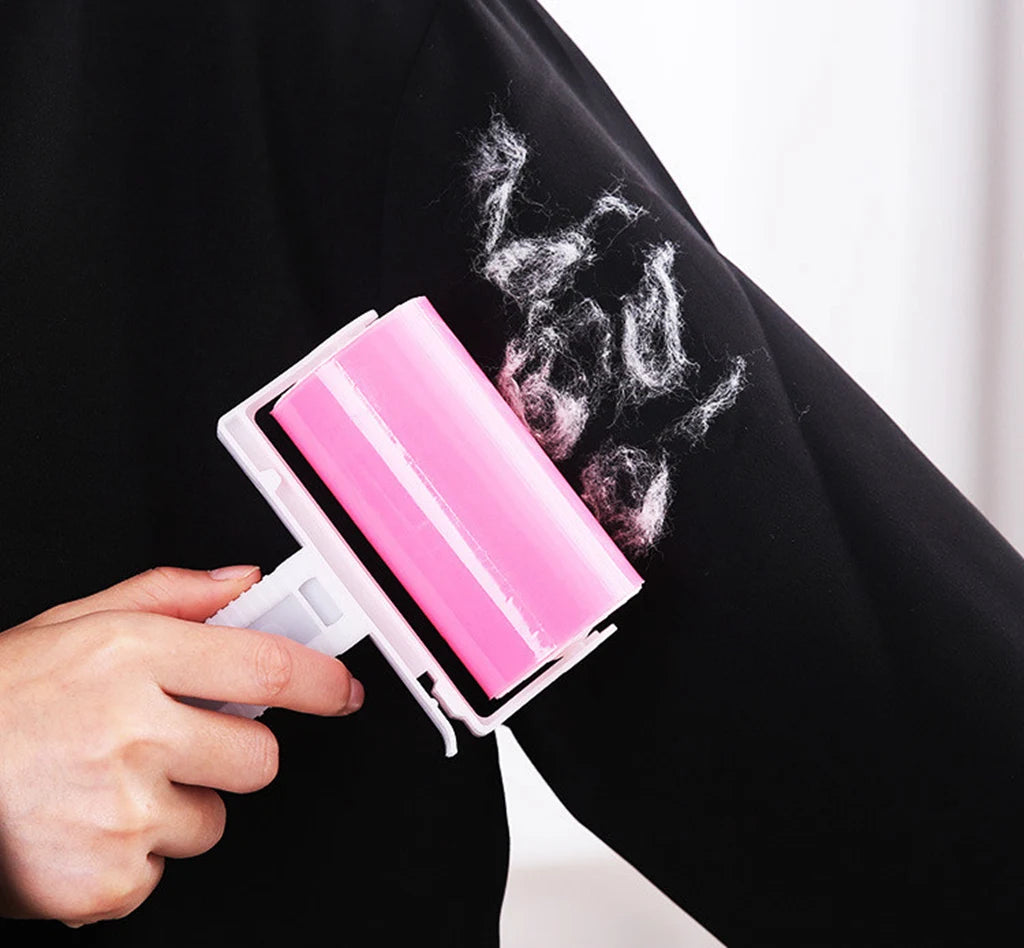 Showlu Smart General Pet Hair Roller Pro cleaning pet hair from furniture and clothing with its sticky roller design.
