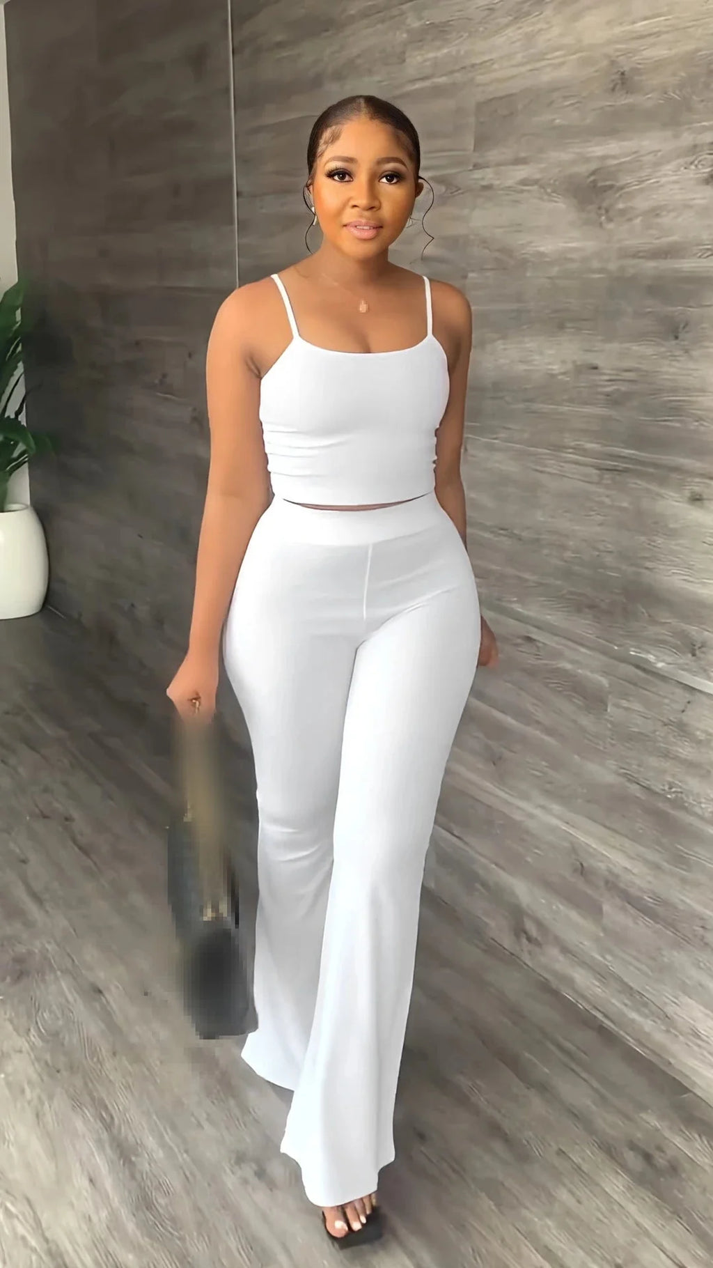Women's summer 2-piece set by SHOWLU FASHION, sleeveless crop top and long pants, casual and stylish for warm weather.