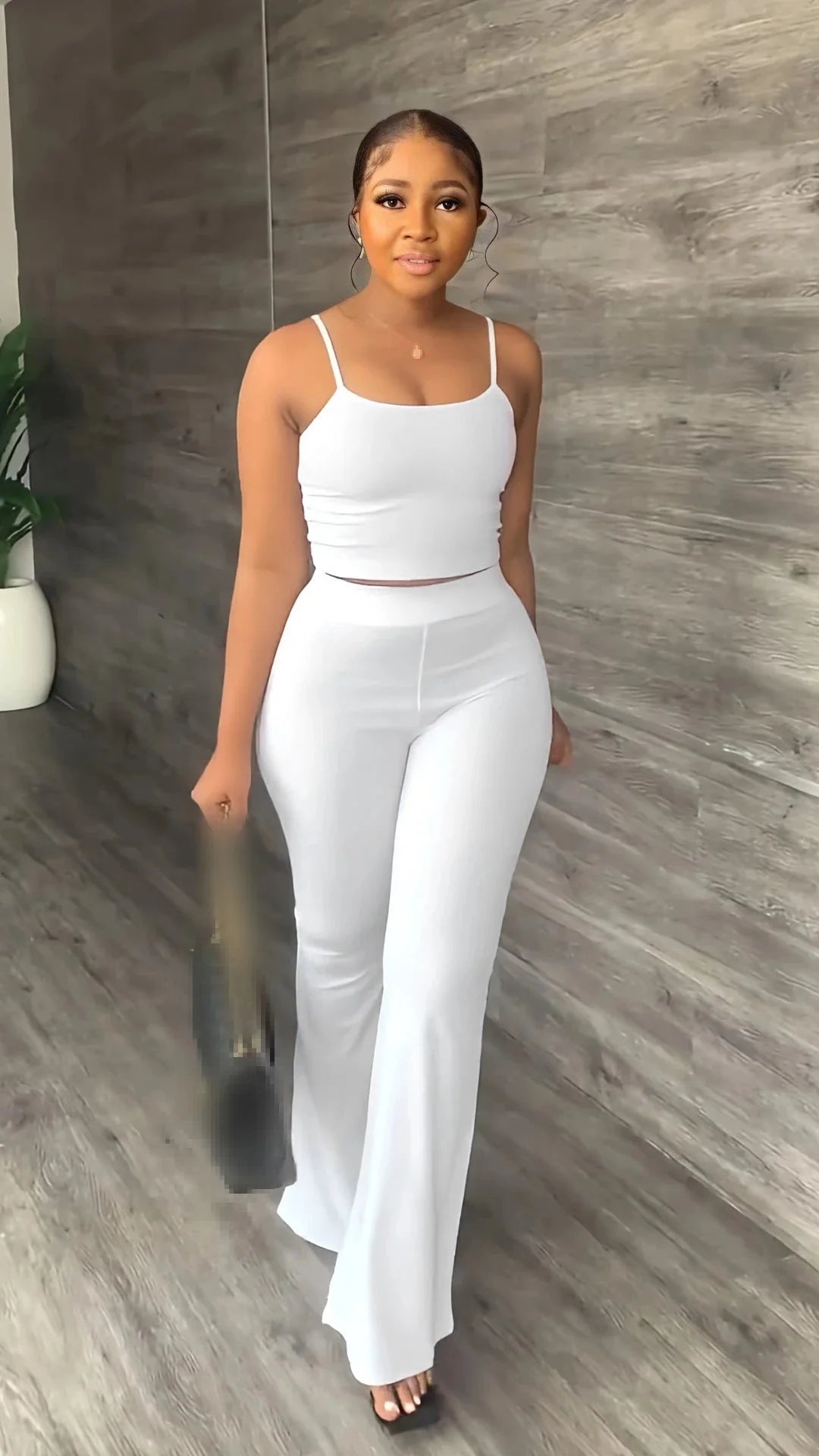 Women's summer 2-piece set by SHOWLU FASHION, sleeveless crop top and long pants, casual and stylish for warm weather.
