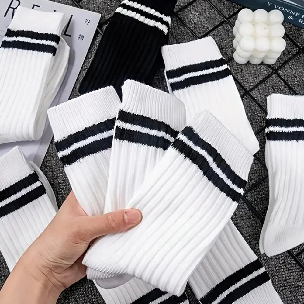 Six pairs of men's black and white striped casual socks featuring breathable mid-tube design and round neck, high-quality Showlu Fashion.