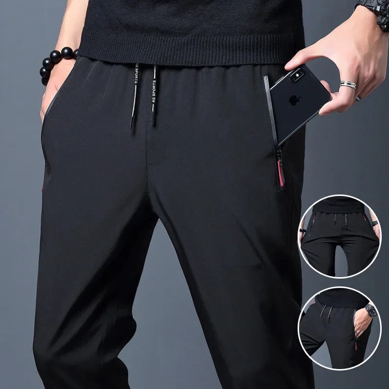 Men's lightweight SHOWLU FASHION STORE slim fit casual pants, straight and jogger style, shown in a neutral color.