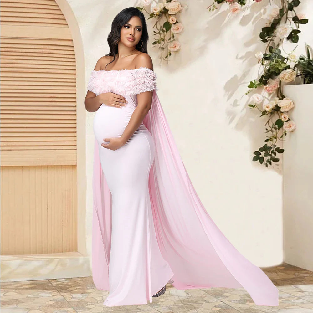 Floral off-shoulder maternity gown with mesh cloak, maxi dress for photoshoot, featuring elegant floral patterns and flowing fabric.