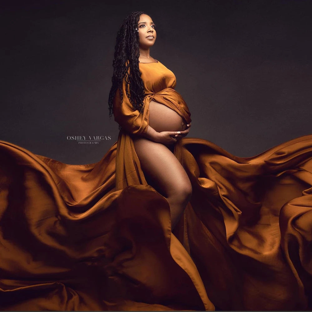 Showlu Maternity chiffon cape made of soft tulle, draped for a photo shoot, elegant maternity fashion accessory.