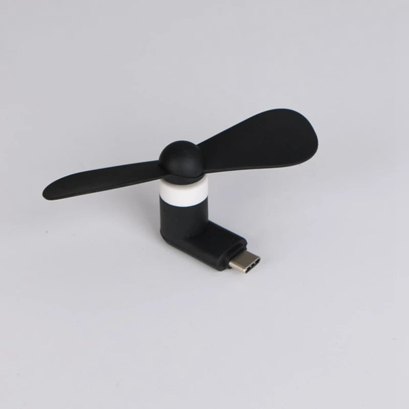 Showlu Smart General USB mini fan with compact design, black body, and adjustable blades for personal cooling.