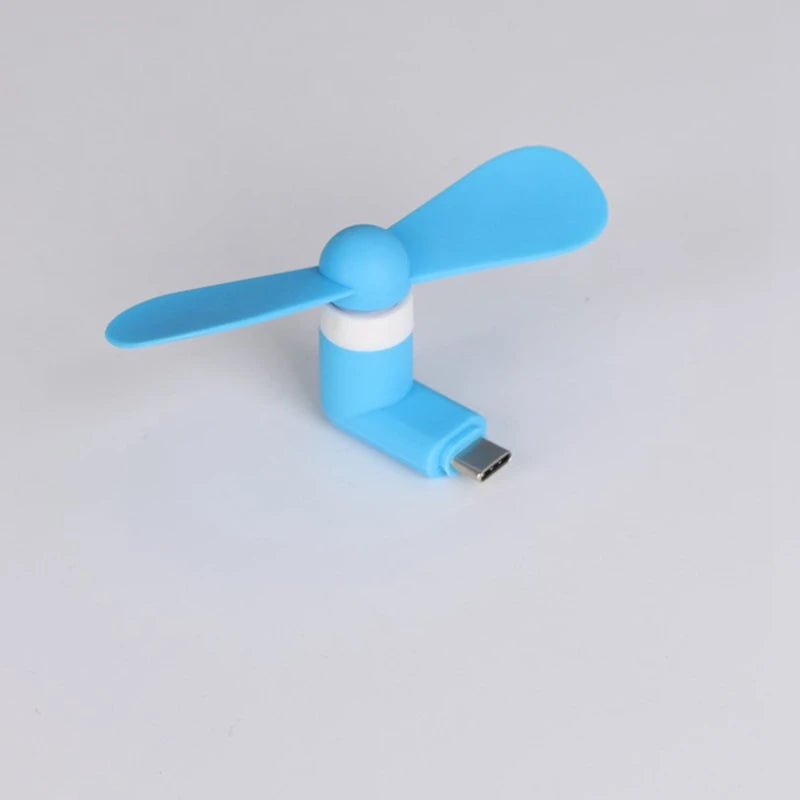 Showlu Smart General USB mini fan showing compact design with adjustable blades and a USB connector for portable cooling.