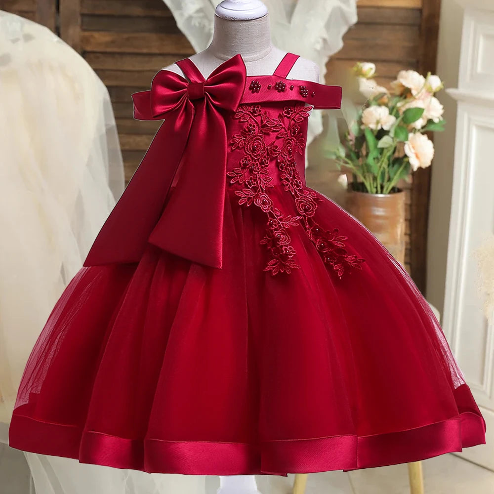 Elegant girls' party dress featuring a bow and flower design, made of tulle for wedding, prom, or birthday occasions.