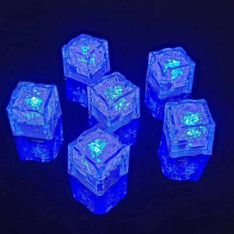 Set of six waterproof LED glowing ice cube lights from Showlu Smart General, liquid sensor drink mood cubes for party decor.