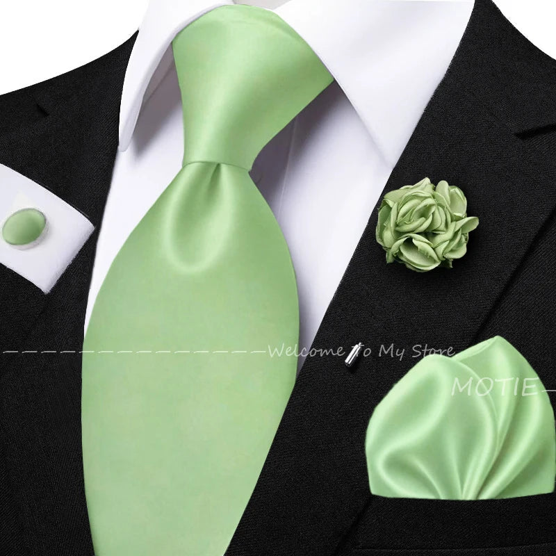 Men's sage green tie set with pocket square, flower brooch, cufflinks, and collar accessory for wedding or daily wear.