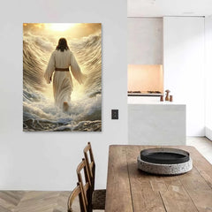 A vertical canvas print of Jesus walking on water hangs on a white wall above a wooden table.
