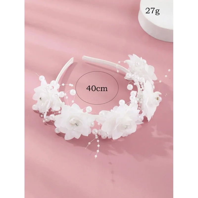 White flower girl headband with elegant floral design, perfect for wedding bridal parties and children's hair accessories.