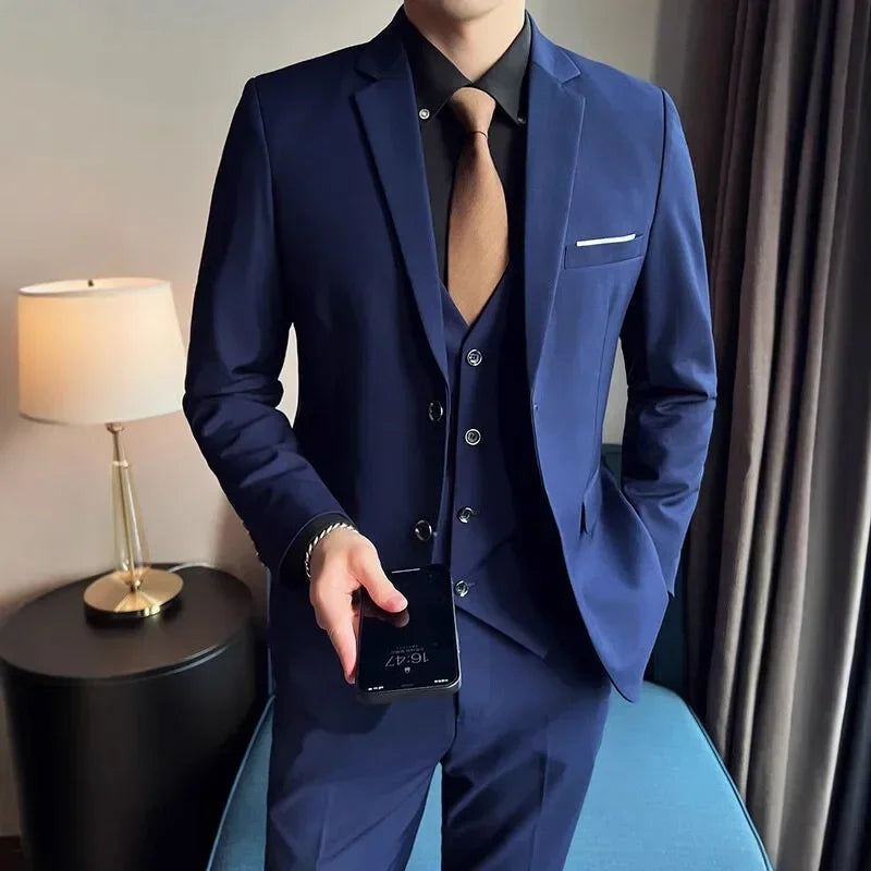 Men's fashionable British-style suit with blazer, vest, and trousers, ideal for business, casual, or wedding occasions.