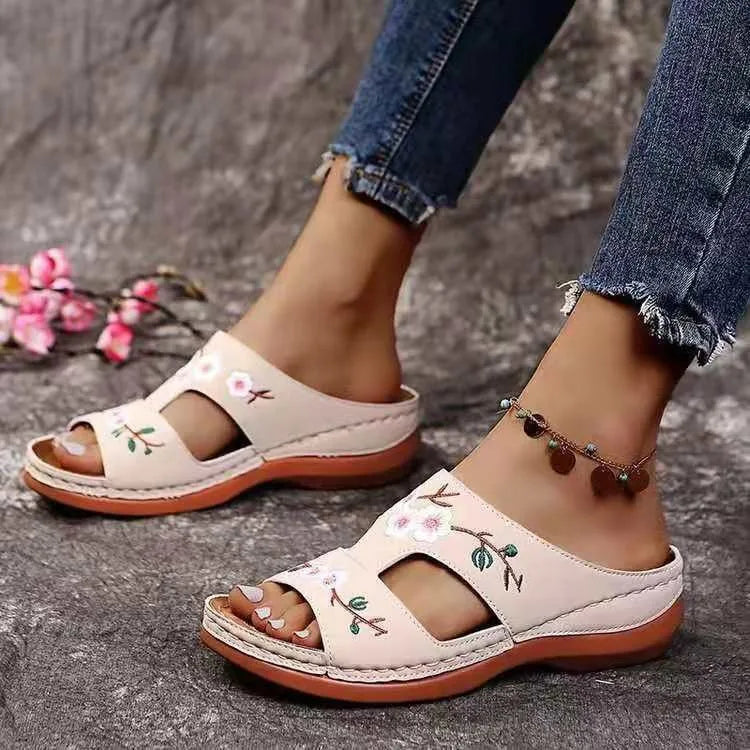 SHOWLU Women's embroidered flower leather wedge sandals with summer-inspired design and floral embroidery on the straps.
