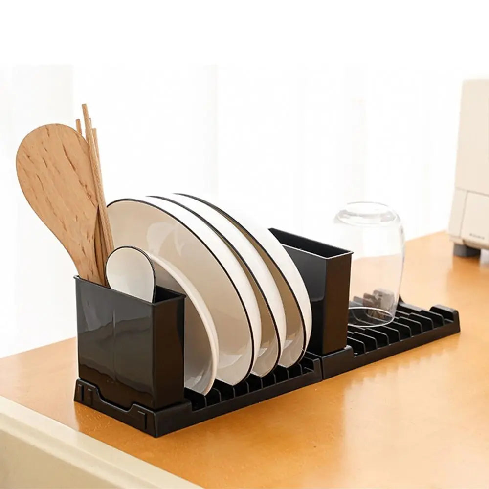 Foldable Showlu Smart General dish drying rack with multiple tiers and metal frame, shown in a compact, open position.