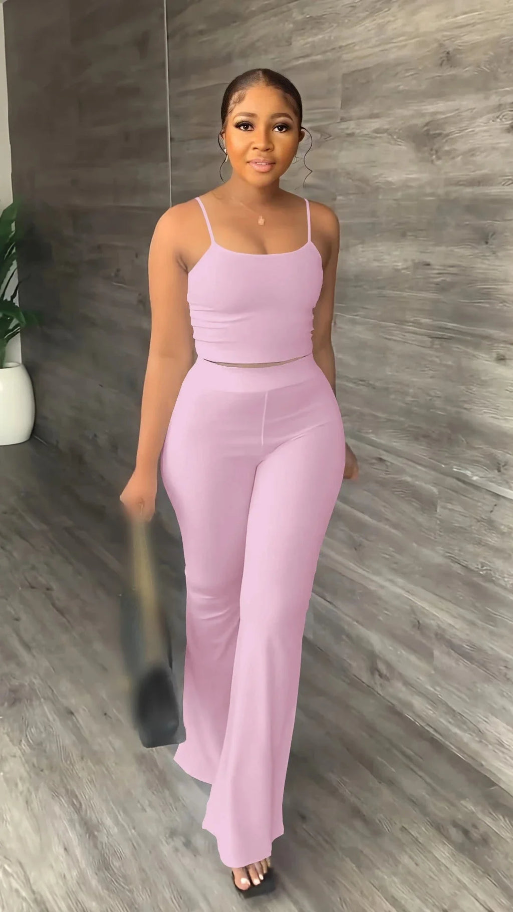 Women's summer two-piece set with sleeveless crop top and long pants by STEFION, featuring a stylish and comfortable casual outfit.