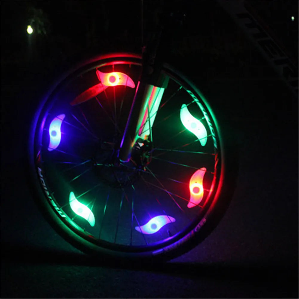 Showlu Smart General bicycle spoke LED wheel light flashing on a bike tire for visibility and safety during night riding.