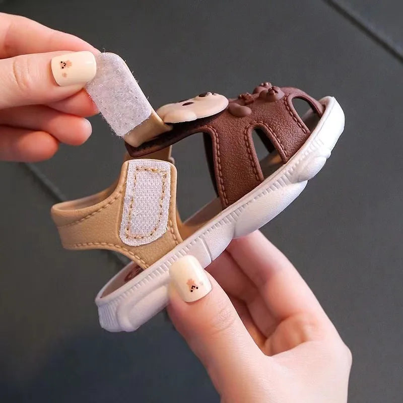 Showlu Baby open-toe clogs with anti-slip soft soles, ideal infant walking shoes, featuring a comfortable and flexible design.