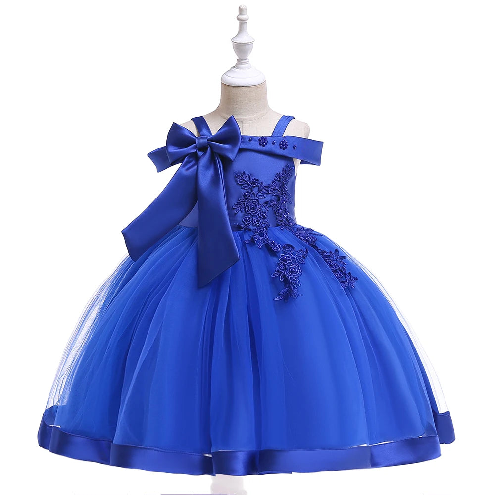 Elegant girls' party dress by Showlu Fashion, featuring a bow, flower accents, tulle skirt, suitable for weddings, birthdays, and special occasions.