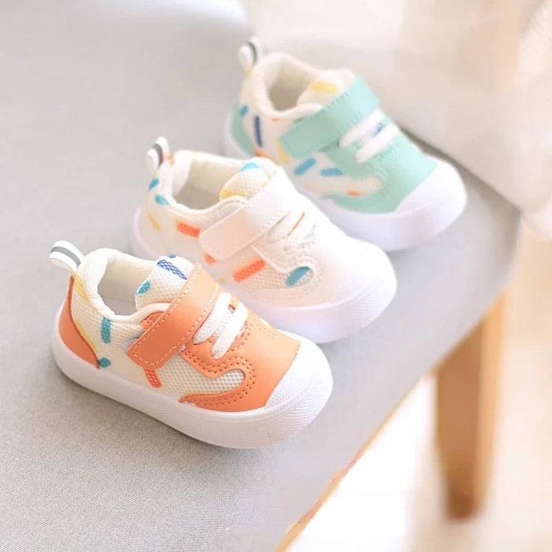 Unisex baby sneakers from SHOWLU FASHION STORE with breathable mesh material and soft rubber soles, perfect for little feet.