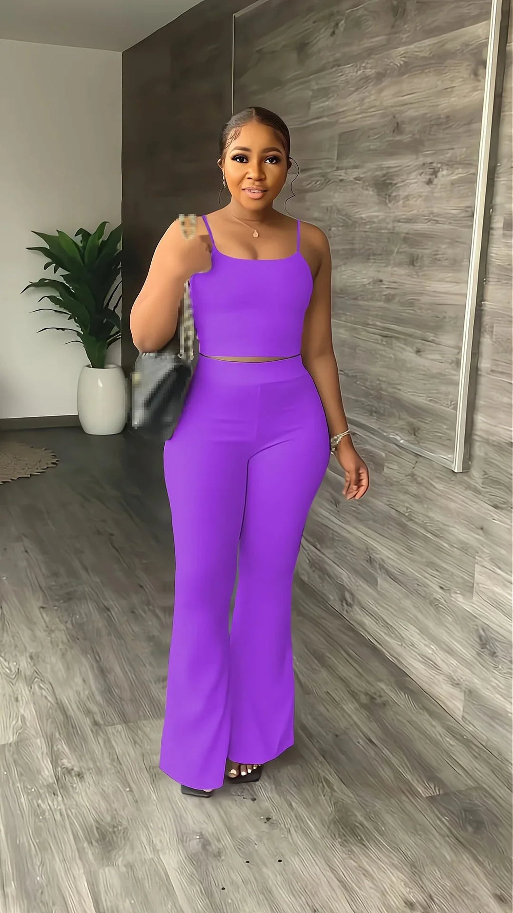 Stefion women's 2-piece summer set with sleeveless crop top and long pants, shown in a stylish summer outfit.