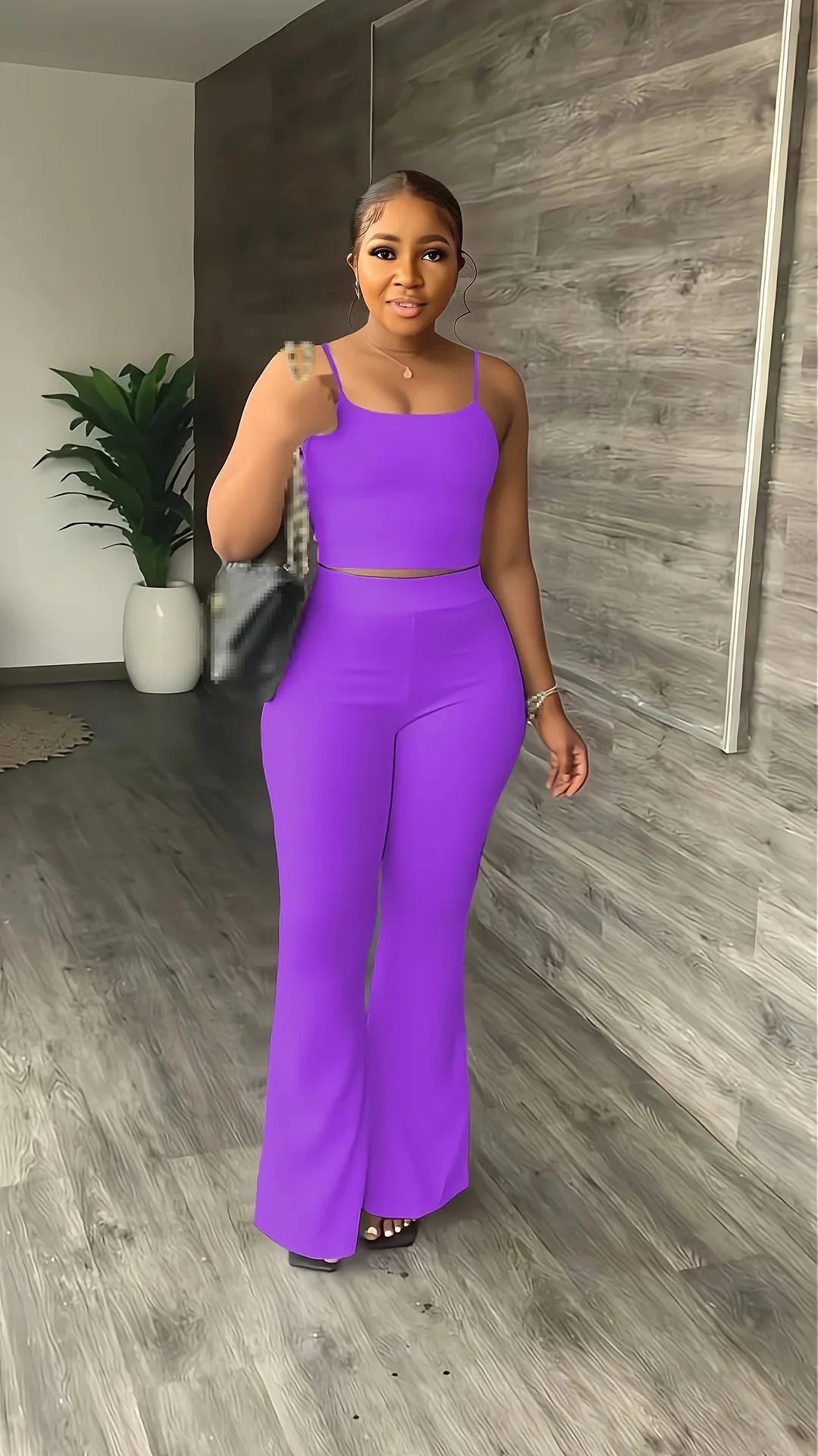 Stefion women's 2-piece summer set with sleeveless crop top and long pants, shown in a stylish summer outfit.