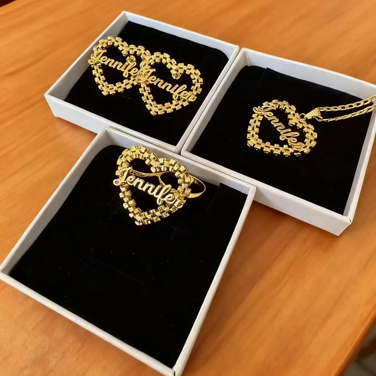 Personalized heart name jewelry set by Showlu, includes custom necklace and earrings with engraved heart designs.
