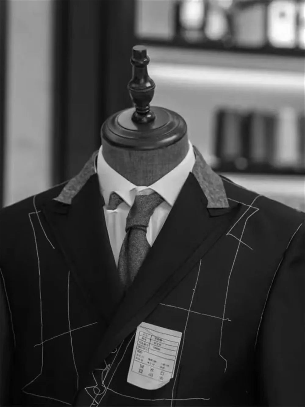 Two-piece men's tuxedo blazer and pants set with double-breasted buttons and peaked lapel, suitable for formal parties or weddings.