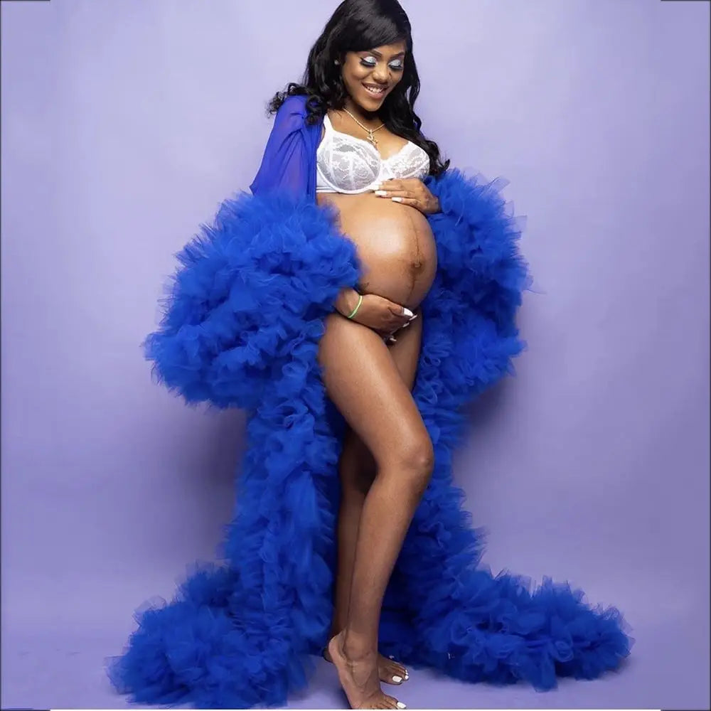 Deep V-neck lace maternity dress by Showlu Fashion with tulle, feather details, long sleeves, and hollow horn accents.