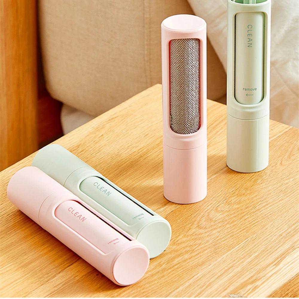 Showlu Smart General reusable pet hair remover roller with a manual lint cleaner and replaceable adhesive sheets for pet hair removal.