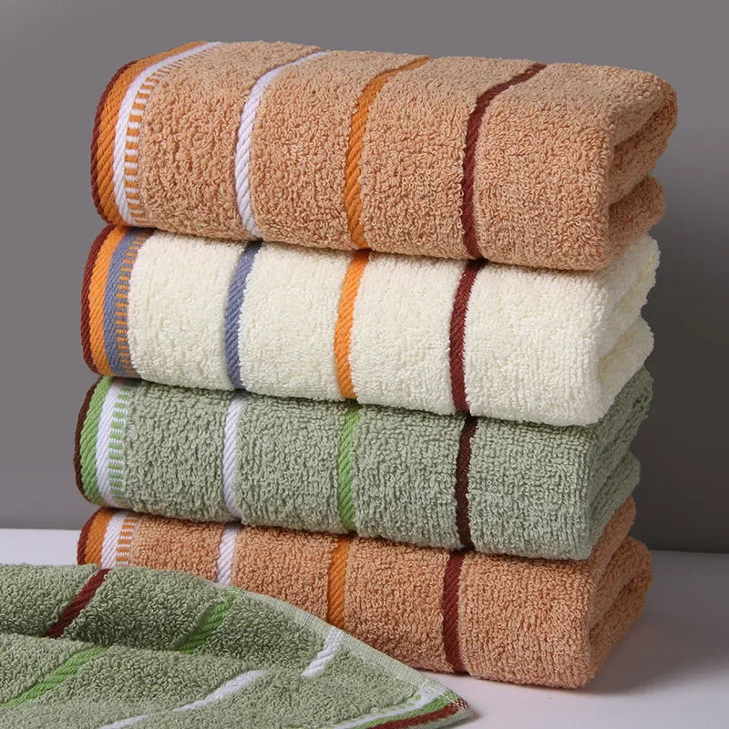SHOWLU 100% cotton hand towel, thickened solid face towel for bathroom use, showcasing soft, absorbent fabric in a neutral color.