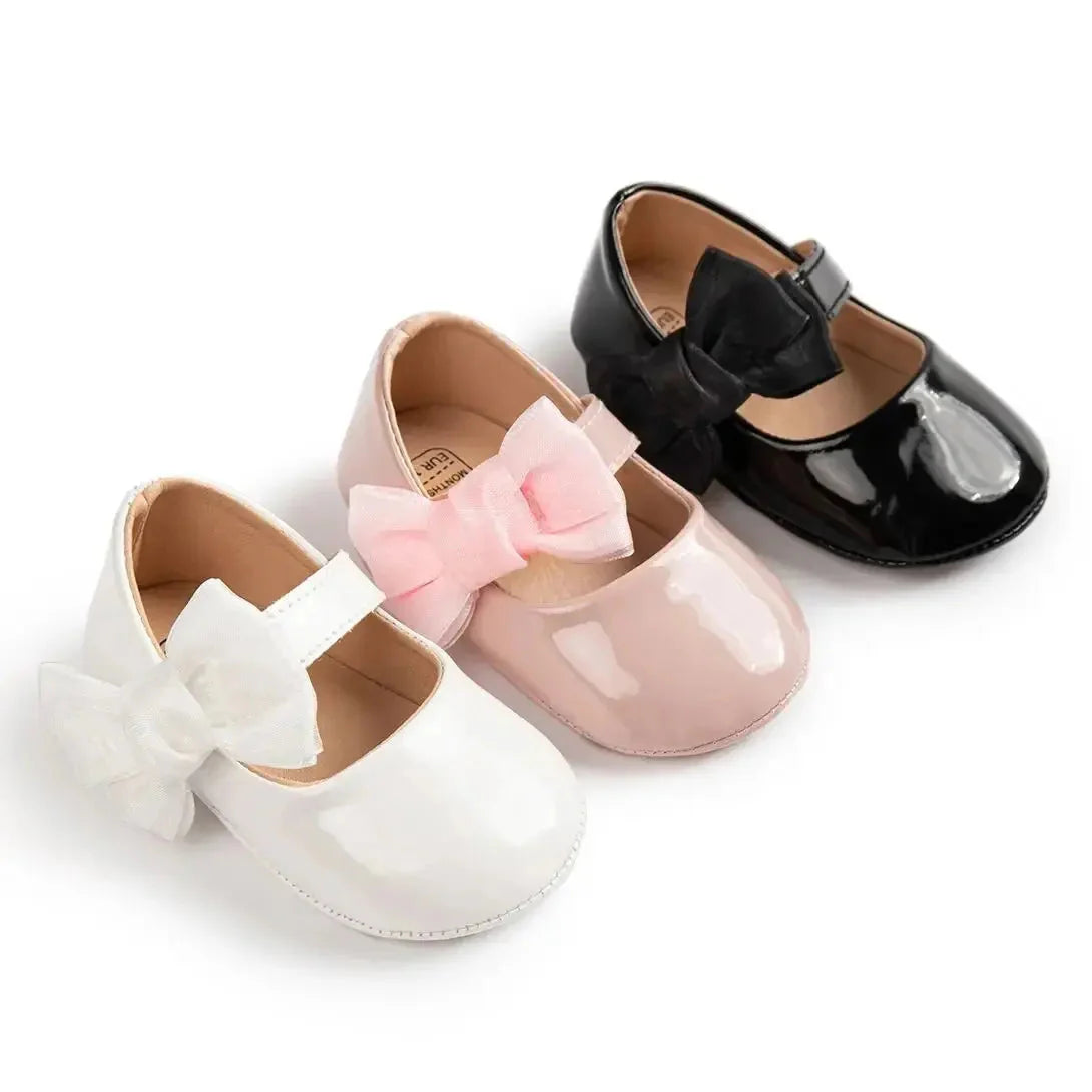Baby girls' PU leather bowknot shoes by Meckior with non-slip soles, perfect for first walkers and casual wear.