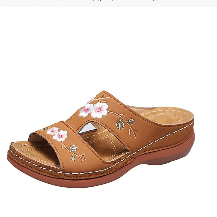 SHOWLU Women's embroidered flower leather wedge sandals with summer slip-on design and decorative floral embroidery.