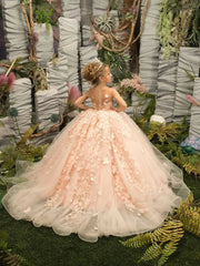 A young girl wears a sleeveless, floor-length pink tulle ball gown with 3D floral appliques.