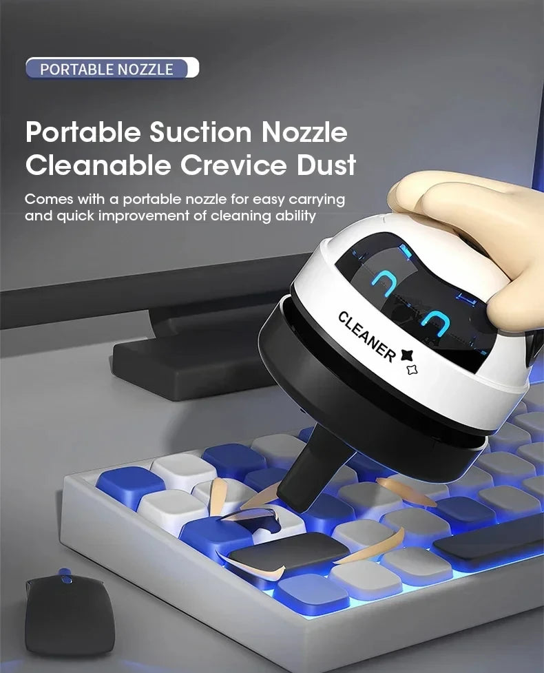Showlu Smart General Mini USB Robot Desk Vacuum cleaning small dust particles on a desk surface.